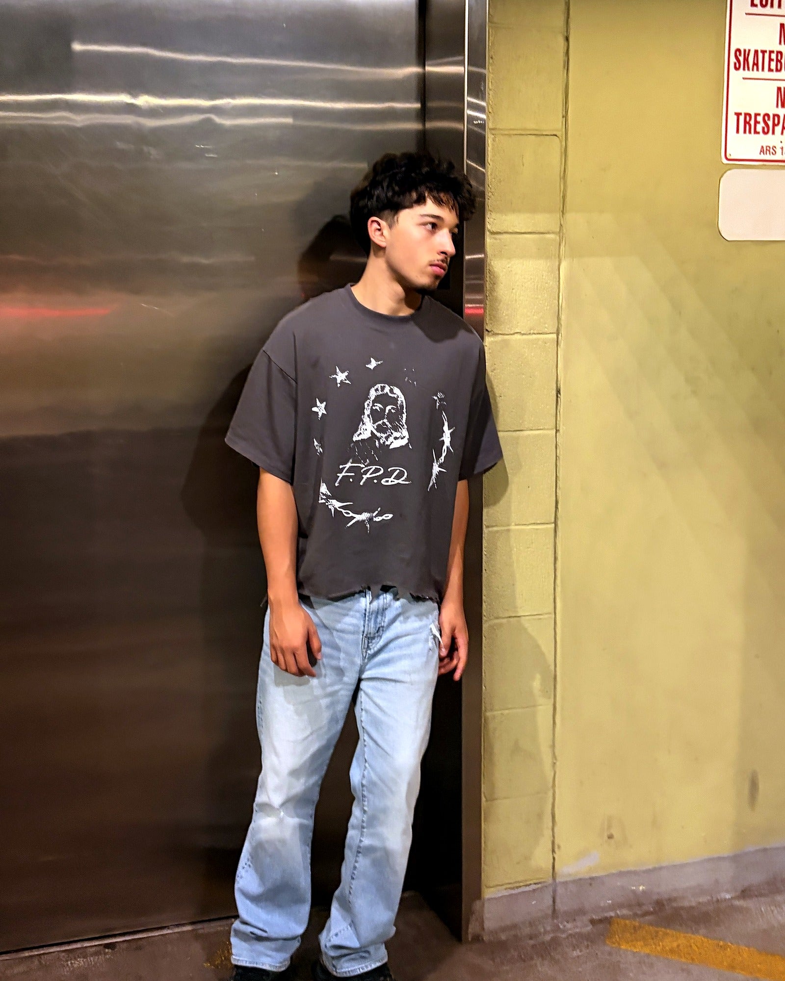 Model wearing black FPD shirt